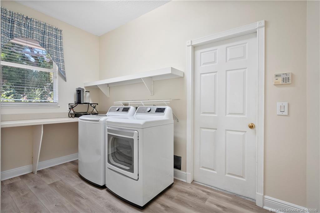 4 Lantana Lane Sewall's Point, FL 34996 - Photo 32 of 47 a utility room with washer and dryer