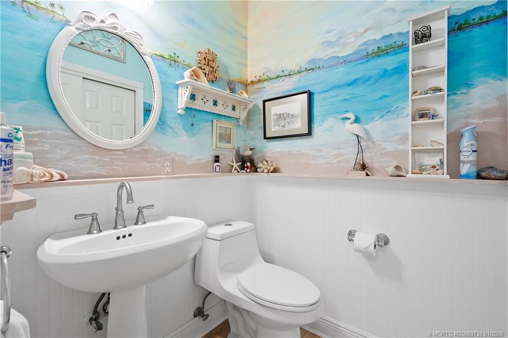 4 Lantana Lane Sewall's Point, FL 34996 - Photo 33 of 47 a bathroom with a toilet a sink and mirror