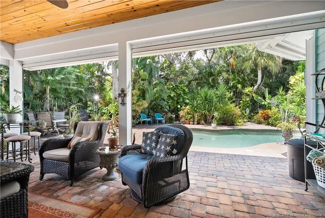 a living room with furniture and a garden