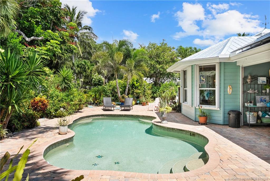 4 Lantana Lane Sewall's Point, FL 34996 - Photo 36 of 47 a view of a house with swimming pool and sitting area