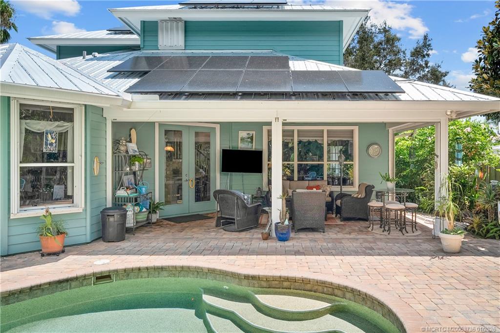 4 Lantana Lane Sewall's Point, FL 34996 - Photo 39 of 47 a front view of a house with garden and porch