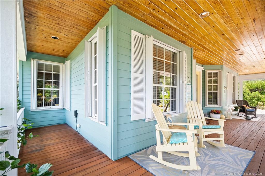 4 Lantana Lane Sewall's Point, FL 34996 - Photo 40 of 47 a front view of a house with outdoor seating