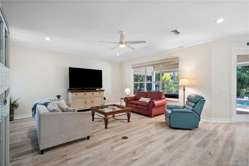 4 Lantana Lane Sewall's Point, FL 34996 - Photo 6 of 47 a living room with furniture and a flat screen tv