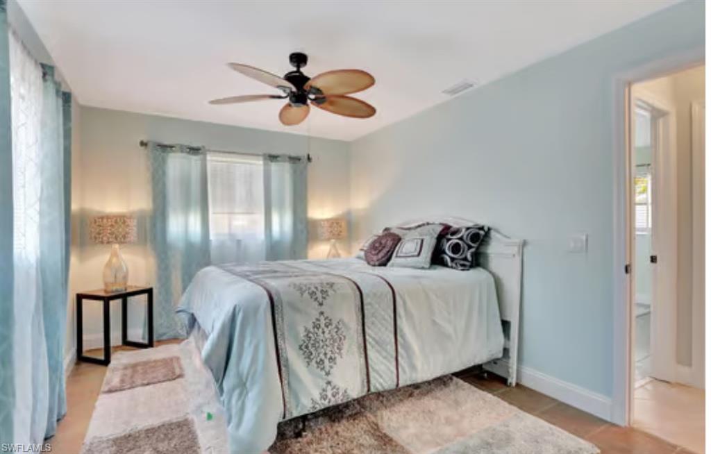 116 Capri Boulevard Naples, FL 34113 - Photo 15 of 29 Bedroom featuring a ceiling fan, baseboards, and visible vents