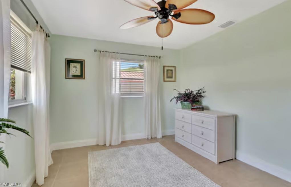 116 Capri Boulevard Naples, FL 34113 - Photo 17 of 29 Bedroom featuring visible vents, ceiling fan, and baseboards