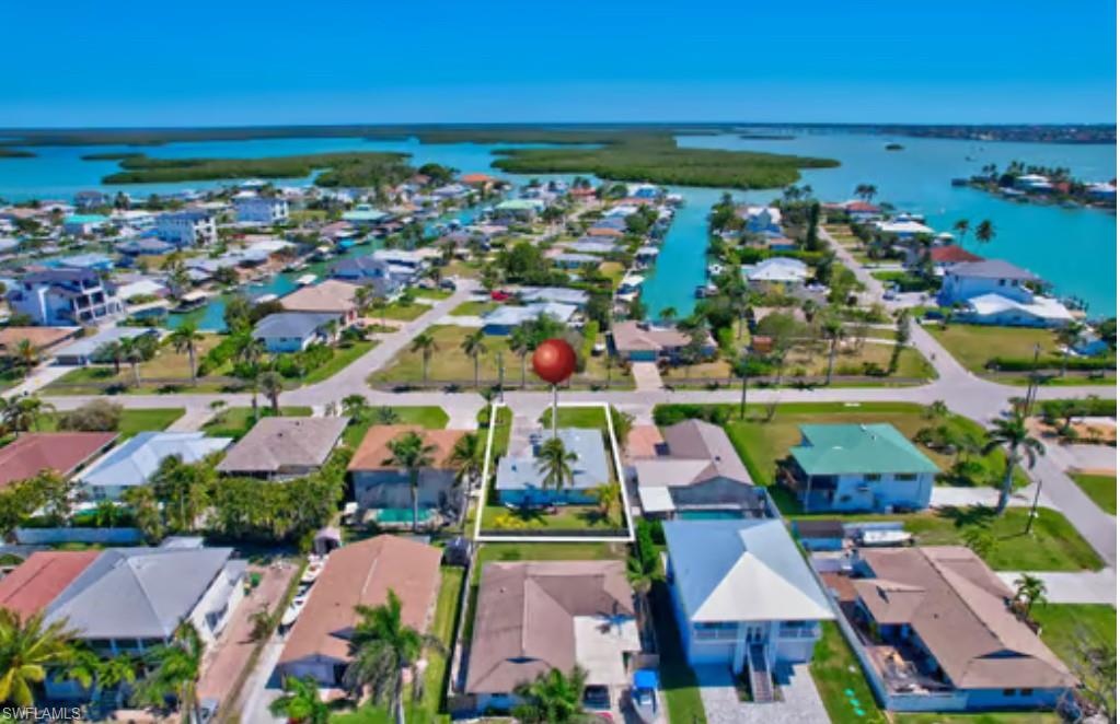 116 Capri Boulevard Naples, FL 34113 - Photo 28 of 29 Aerial view featuring a residential view and a water view