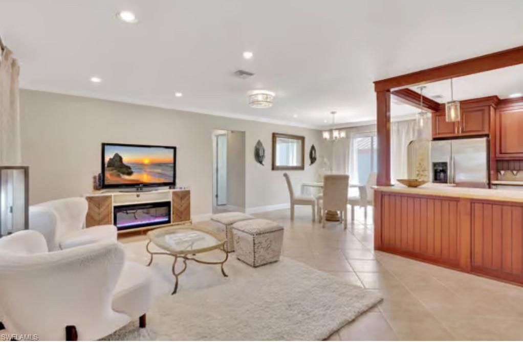 116 Capri Boulevard Naples, FL 34113 - Photo 4 of 29 Living area featuring visible vents, light tile patterned floors, recessed lighting, and baseboards