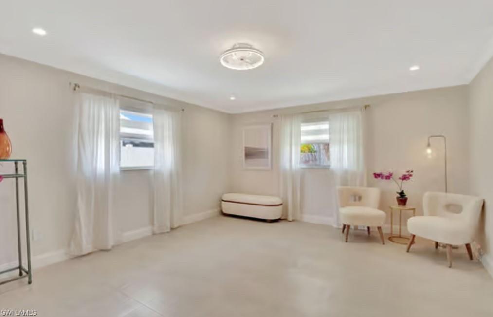 116 Capri Boulevard Naples, FL 34113 - Photo 7 of 29 Living area with plenty of natural light, recessed lighting, and baseboards