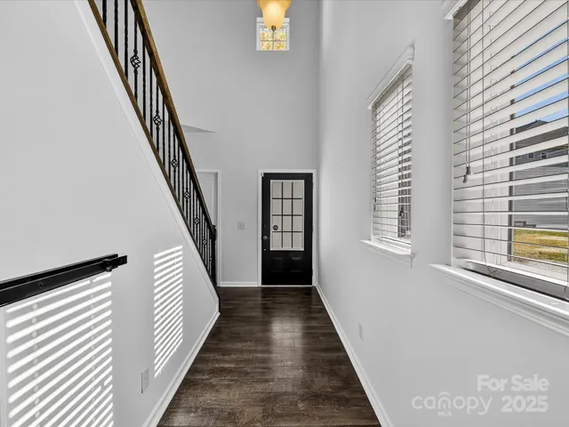 a view of a hallway with windows