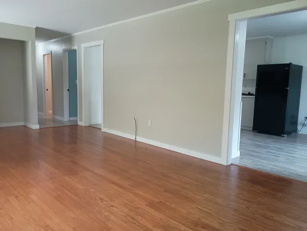 a view of a livingroom with wooden floor