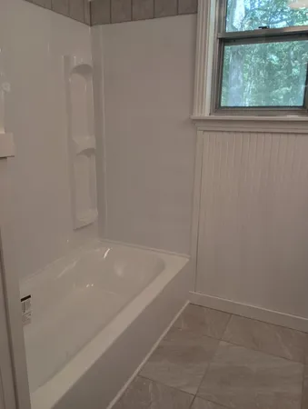 a bathroom with a bathtub