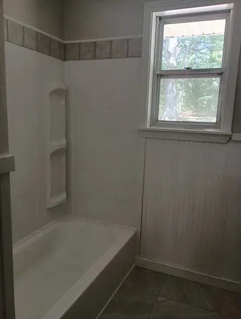 a bathroom with a bathtub