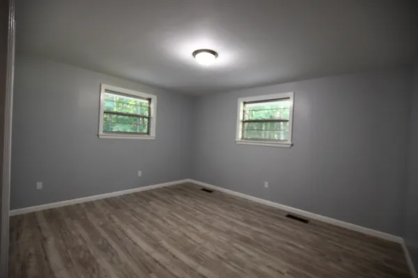 an empty room with windows