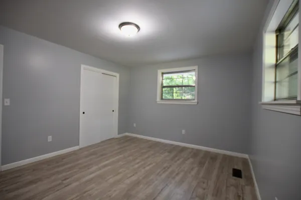 an empty room that has a window