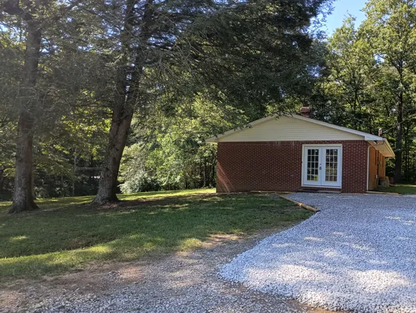 a house with trees in the background