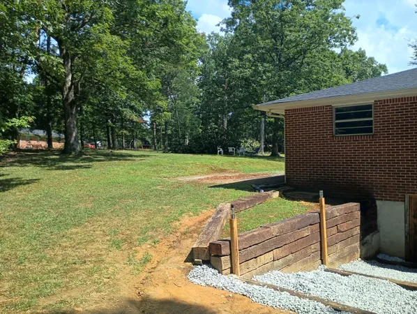 a view of a backyard with trampoline