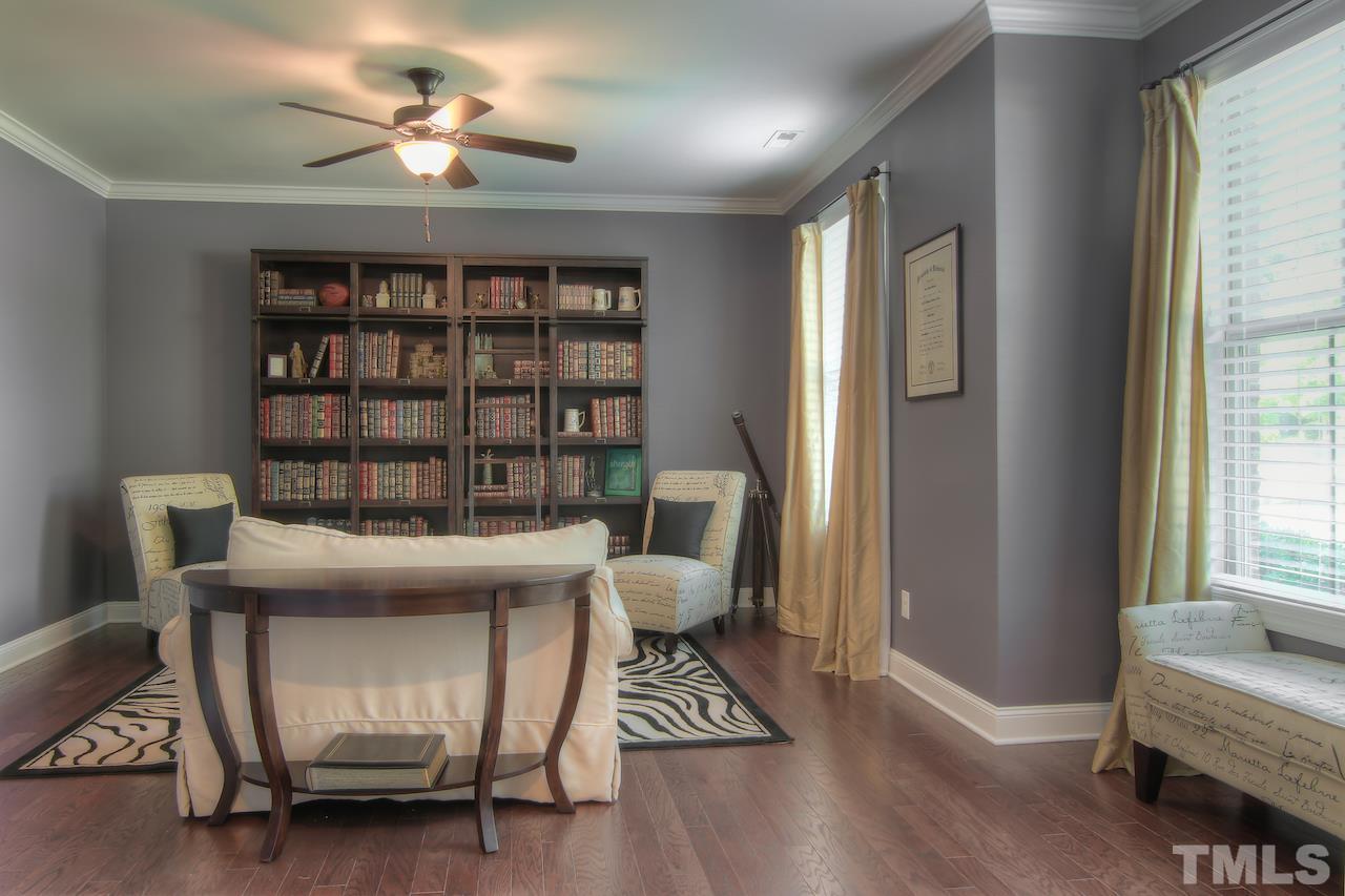 8333 Henderson Road Apex, NC 27539 - Photo 3 of 25 a view of a workspace with furniture and a window