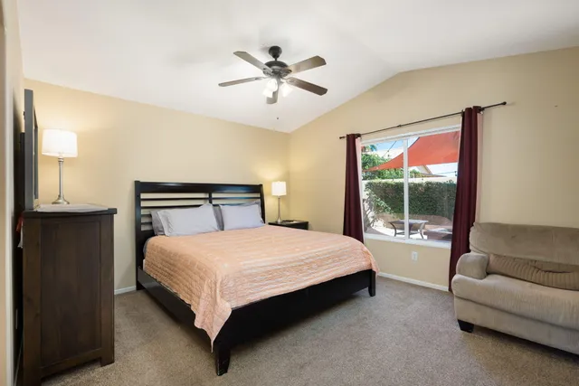 a bedroom with a bed and a couch