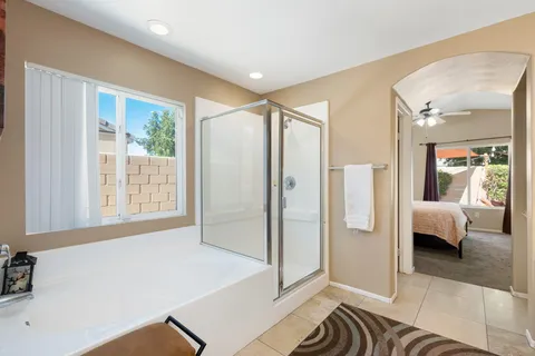 a spacious bathroom with a tub and shower