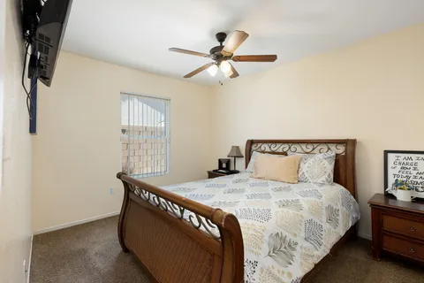 a bedroom with a bed and a window