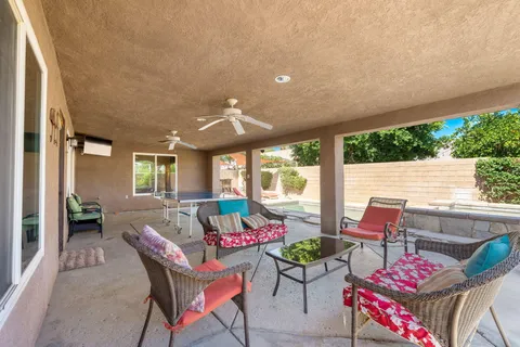 a outdoor space with patio the couches and a potted plant