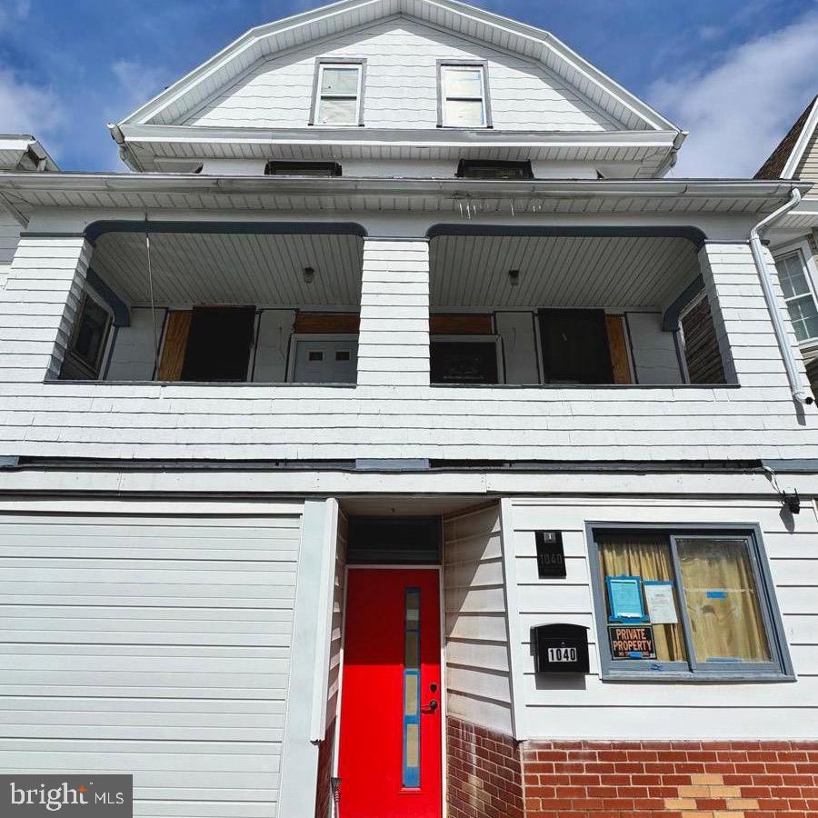 1040 Scott Street Kulpmont, PA 17834 - Photo 1 of 10 a view of a building with a door