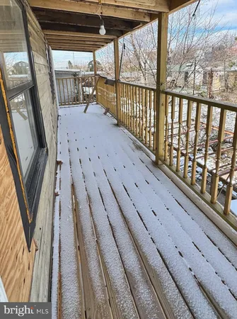 a view of balcony with wooden floor