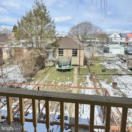 a view of a balcony with an outdoor seating