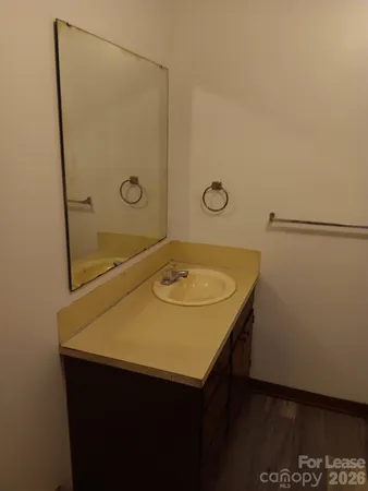 a bathroom with a sink and mirror