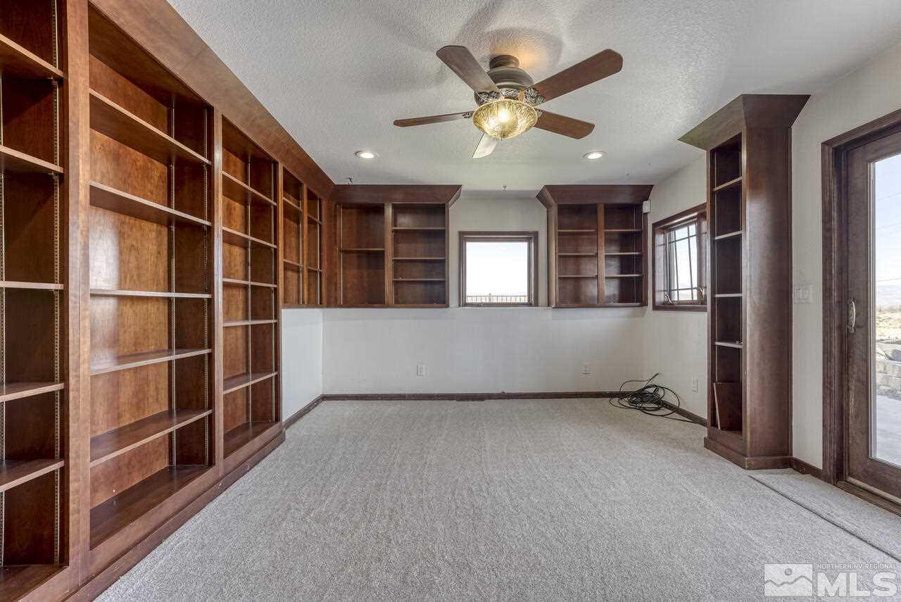 650 Desert Shadows Lane Fernley, NV 89408 - Photo 14 of 39 an empty room with windows
