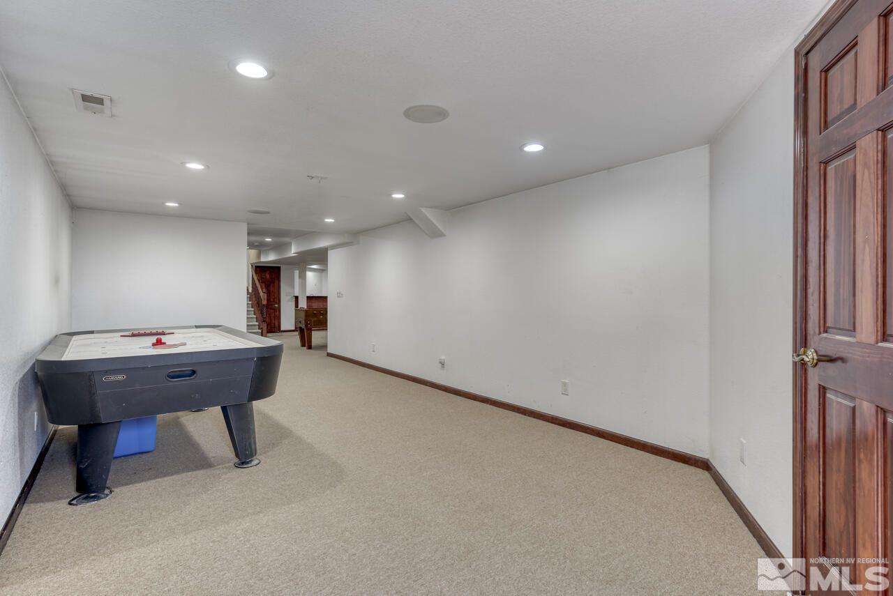 650 Desert Shadows Lane Fernley, NV 89408 - Photo 17 of 39 a view of a room with furniture and a window