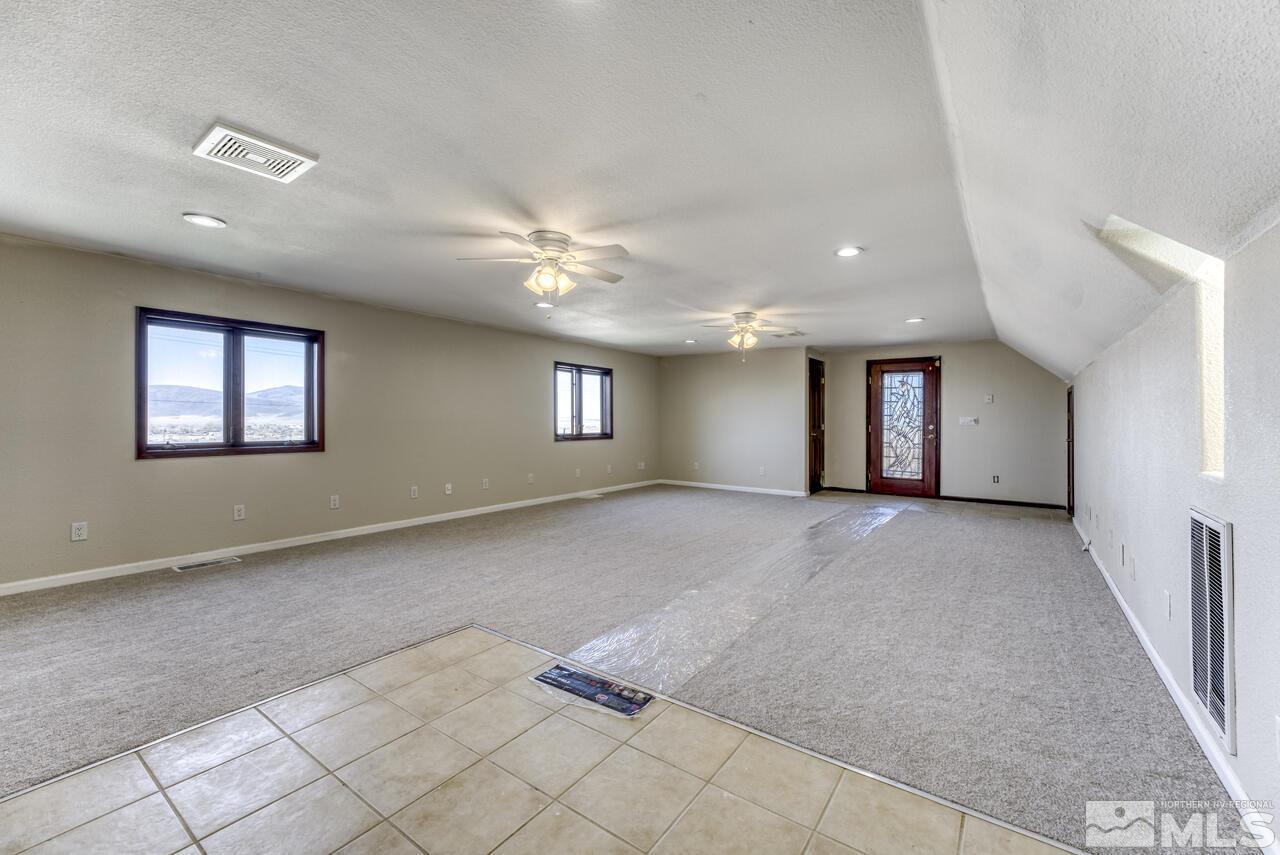 650 Desert Shadows Lane Fernley, NV 89408 - Photo 18 of 39 a view of a livingroom with a staircase