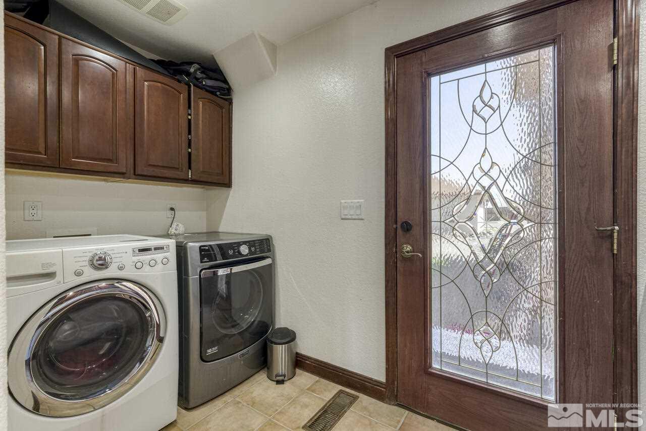650 Desert Shadows Lane Fernley, NV 89408 - Photo 20 of 39 a utility room with dryer and washer