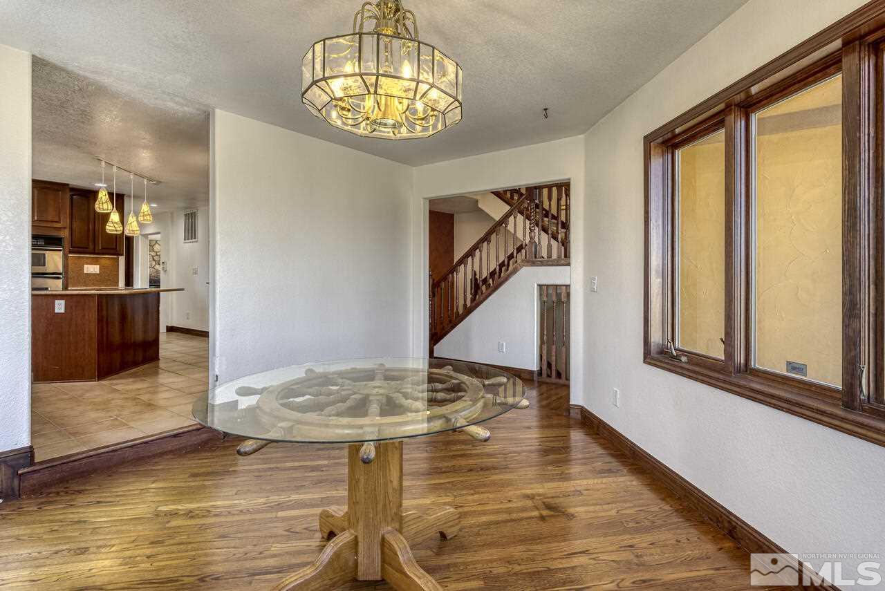 650 Desert Shadows Lane Fernley, NV 89408 - Photo 24 of 39 a view of a livingroom with furniture window and wooden floor