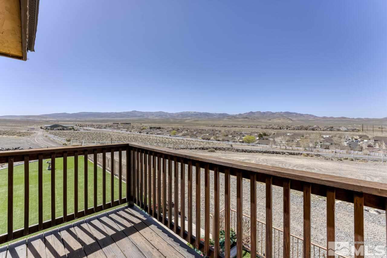 650 Desert Shadows Lane Fernley, NV 89408 - Photo 30 of 39 a balcony with an outdoor space