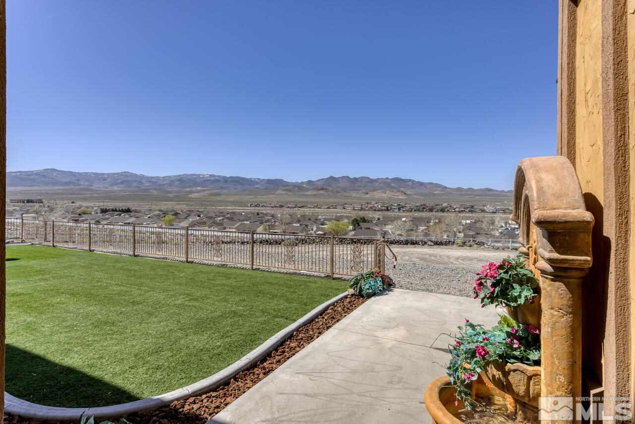 650 Desert Shadows Lane Fernley, NV 89408 - Photo 31 of 39 a view of a garden with a lake view