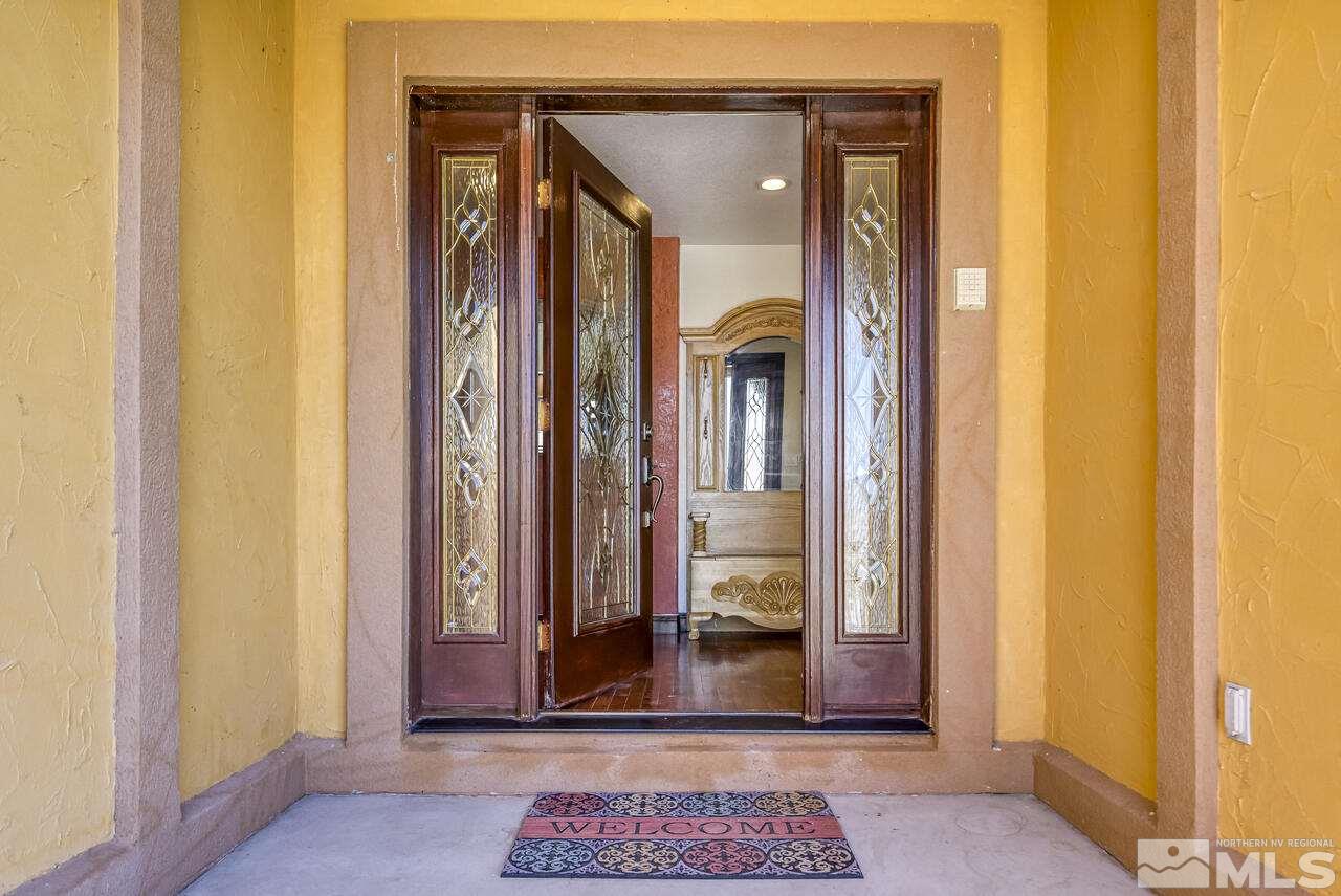 650 Desert Shadows Lane Fernley, NV 89408 - Photo 32 of 39 an entrance view with wooden floor and a bathroom