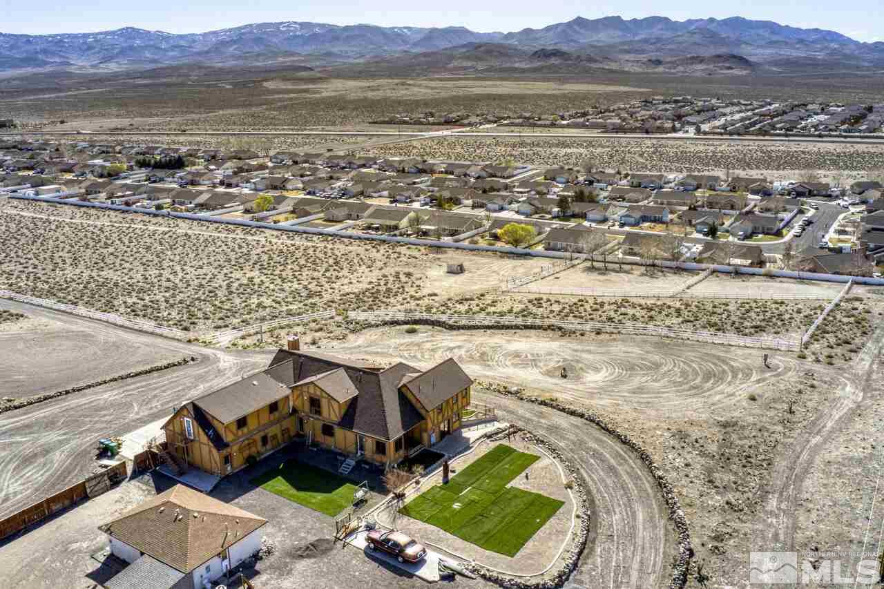650 Desert Shadows Lane Fernley, NV 89408 - Photo 35 of 39 an aerial view of residential houses with outdoor space and seating