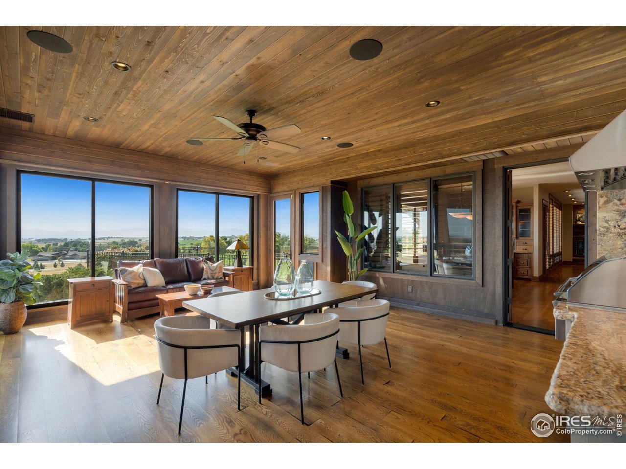 39759 Pinnacle Ridge Court Severance, CO 80610 - Photo 19 of 40 a living room with furniture and a large window
