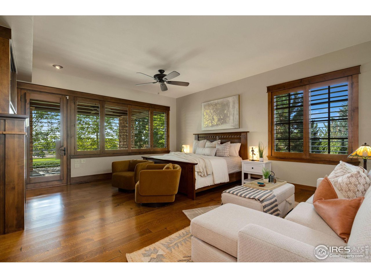 39759 Pinnacle Ridge Court Severance, CO 80610 - Photo 20 of 40 a living room with furniture floor to ceiling window and wooden floor