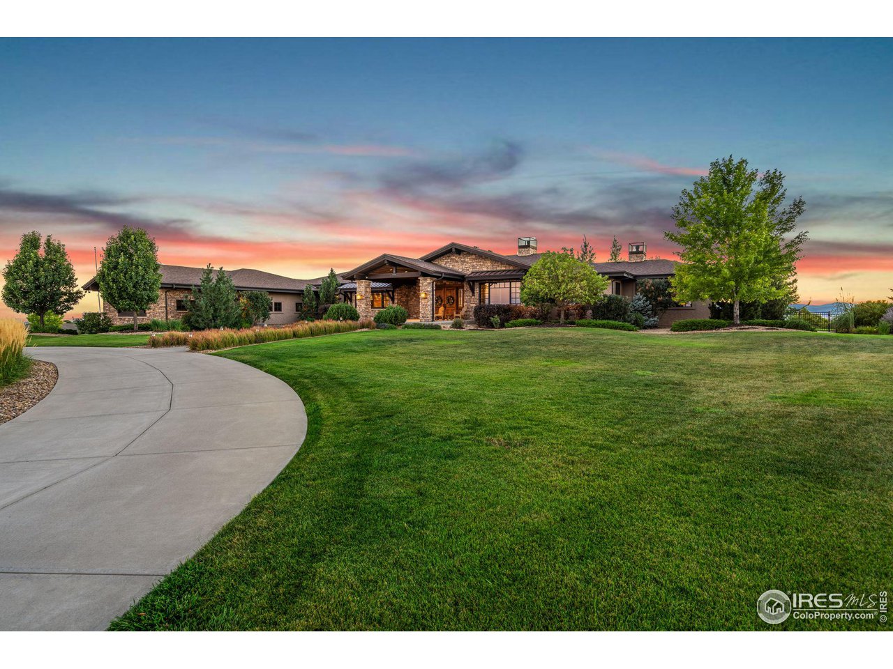39759 Pinnacle Ridge Court Severance, CO 80610 - Photo 2 of 40 a view of a garden with a building in the background