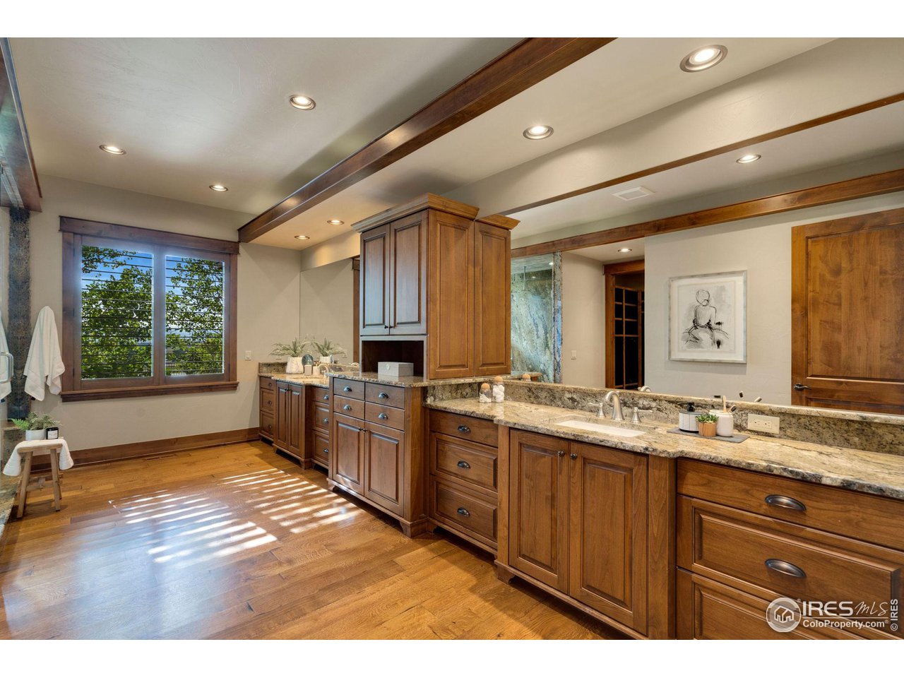 39759 Pinnacle Ridge Court Severance, CO 80610 - Photo 22 of 40 a bathroom with a sink mirror and a bath tub