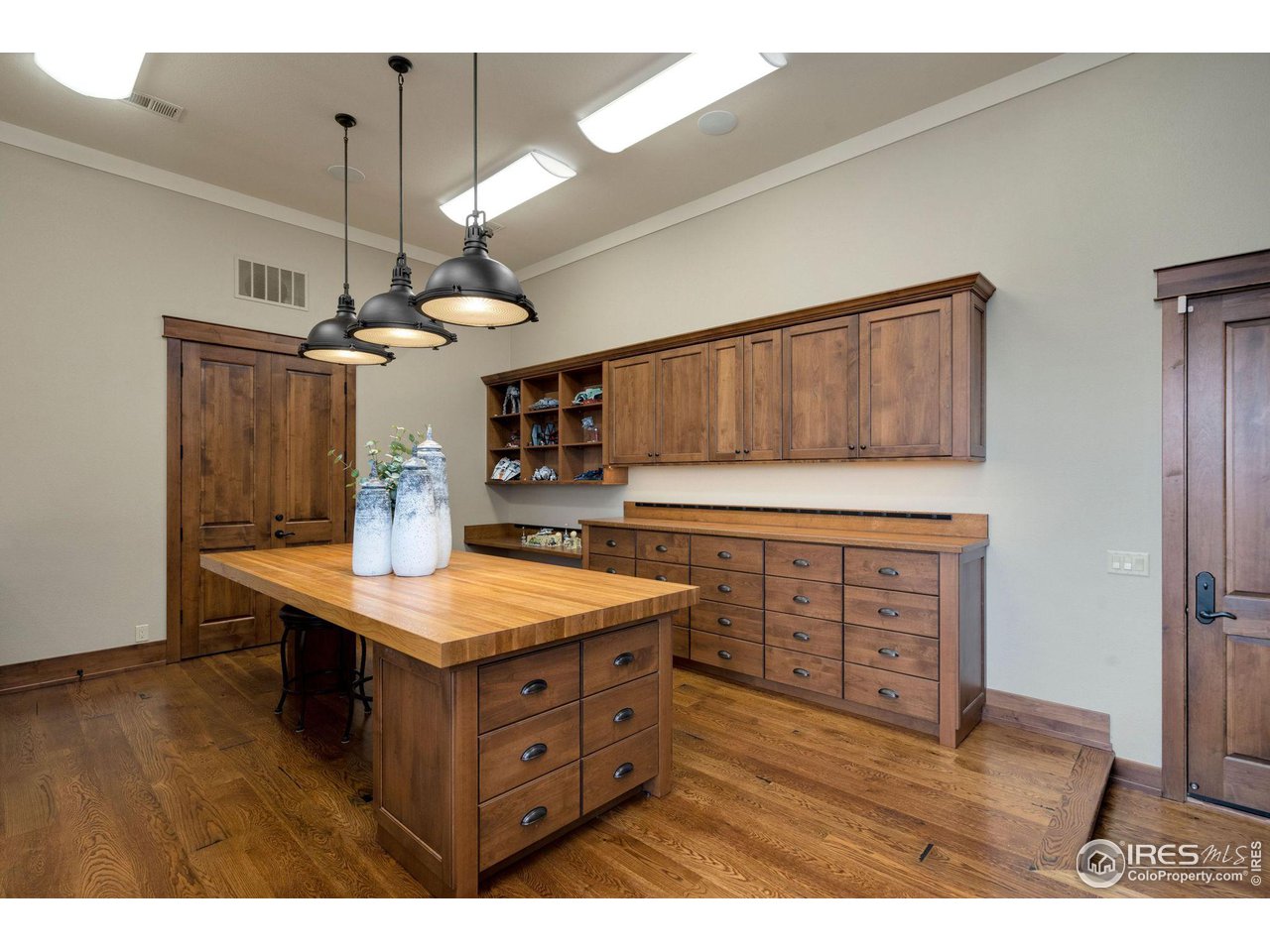 39759 Pinnacle Ridge Court Severance, CO 80610 - Photo 29 of 40 a kitchen view with granite countertop a sink cabinets and wooden floor