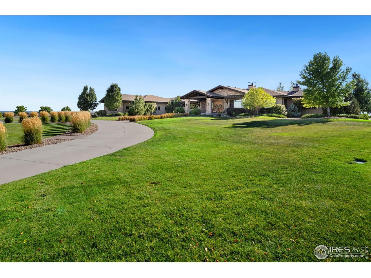 39759 Pinnacle Ridge Court Severance, CO 80610 - Photo 3 of 40 a view of a house with a yard