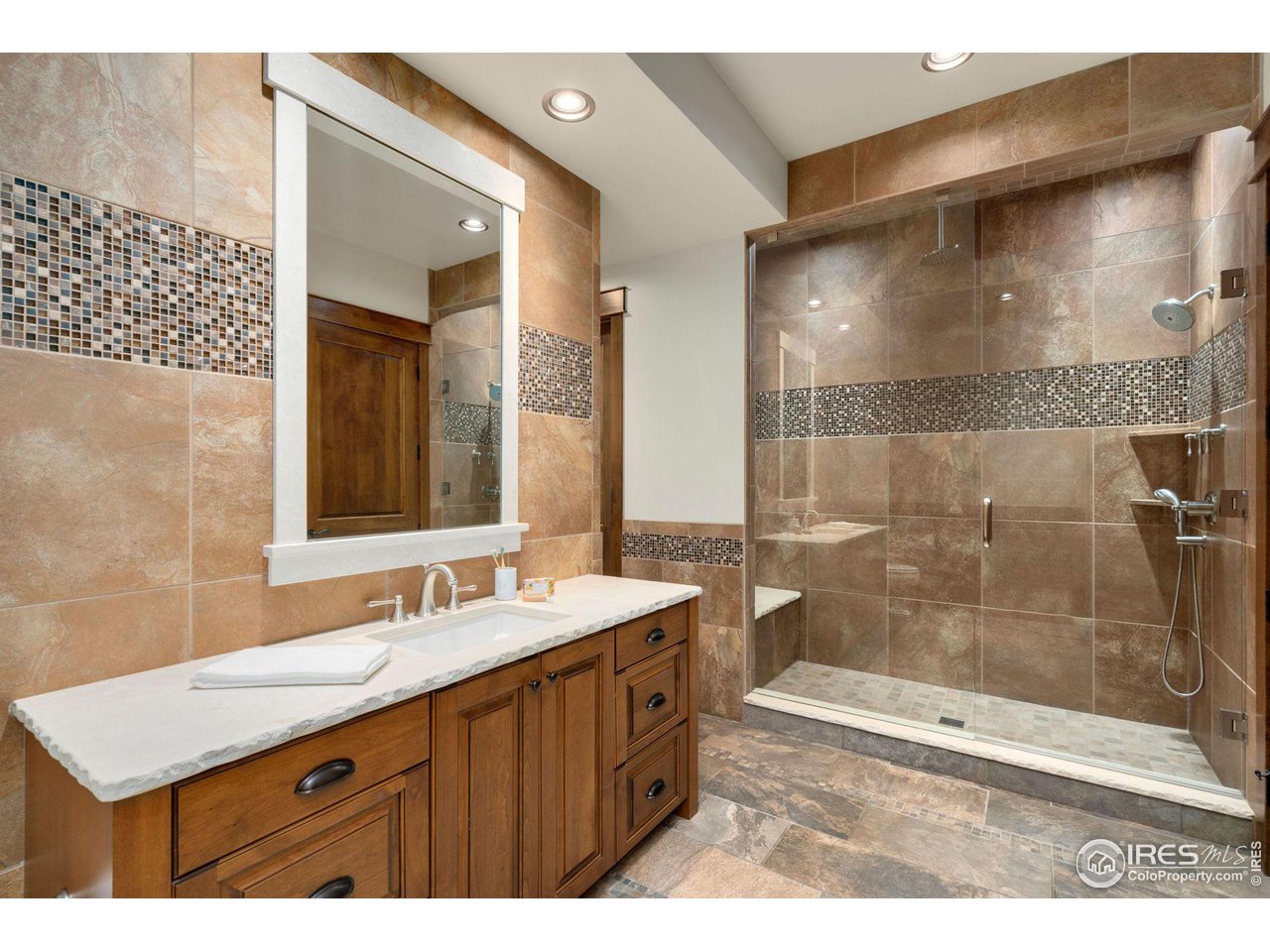 39759 Pinnacle Ridge Court Severance, CO 80610 - Photo 35 of 40 a bathroom with a sink a toilet and shower