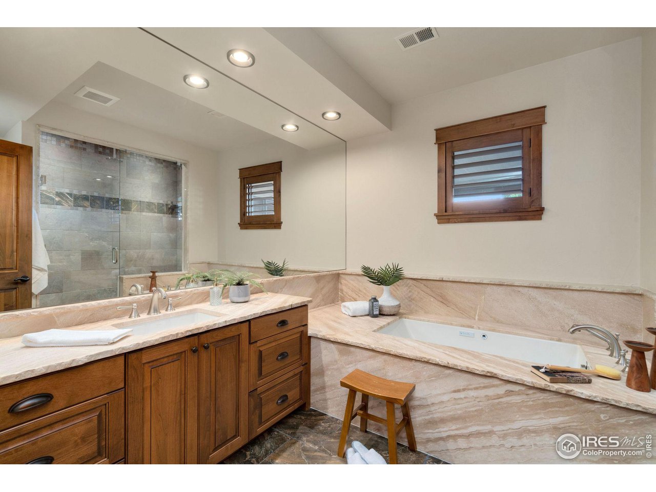 39759 Pinnacle Ridge Court Severance, CO 80610 - Photo 36 of 40 a bathroom with a sink and a mirror
