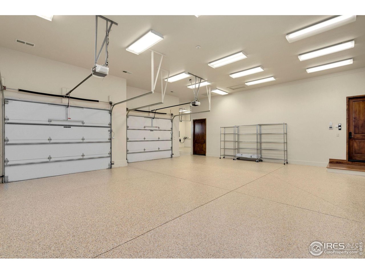 39759 Pinnacle Ridge Court Severance, CO 80610 - Photo 37 of 40 a view of a big room with cabinets and wooden floor