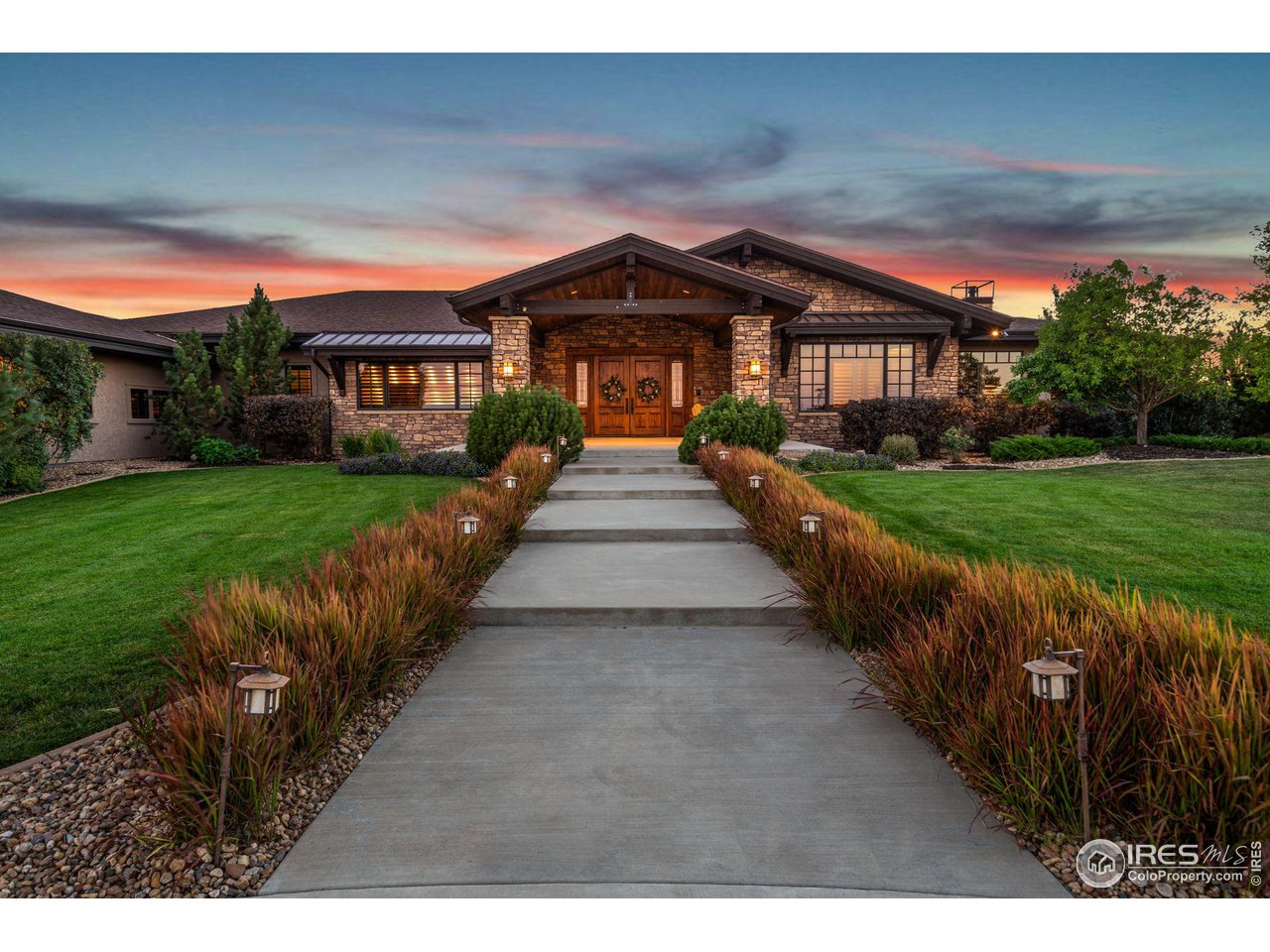 39759 Pinnacle Ridge Court Severance, CO 80610 - Photo 4 of 40 a front view of a house with a yard