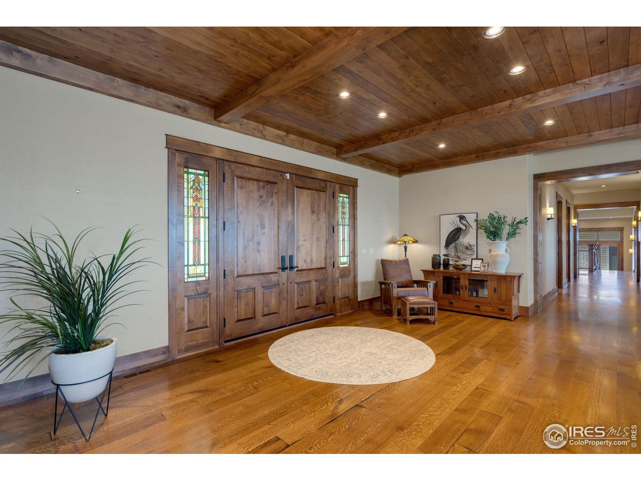 39759 Pinnacle Ridge Court Severance, CO 80610 - Photo 6 of 40 a living room with furniture and a dining table