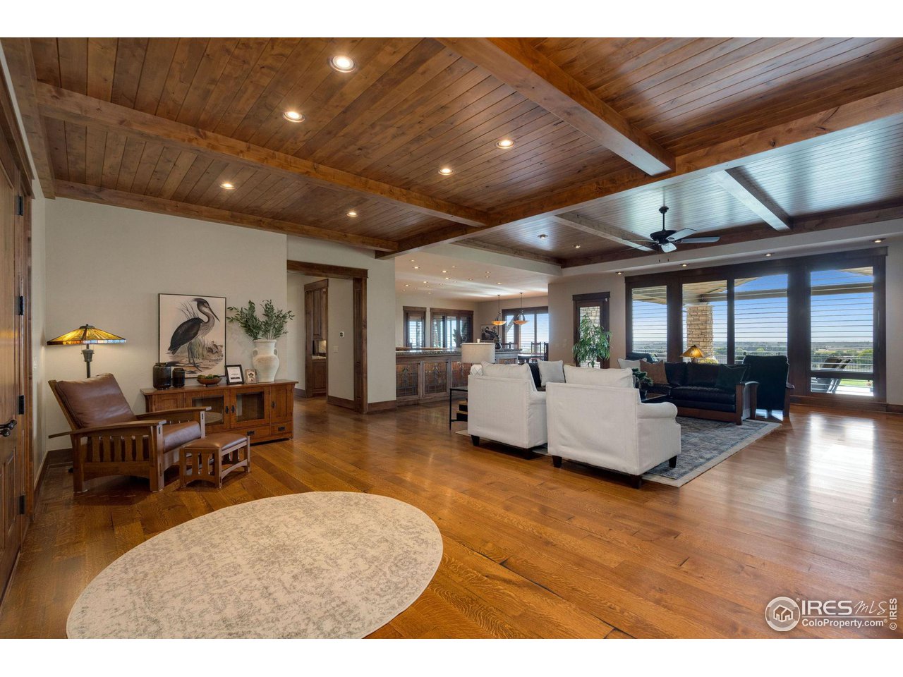 39759 Pinnacle Ridge Court Severance, CO 80610 - Photo 7 of 40 a living room with furniture and a wooden floor